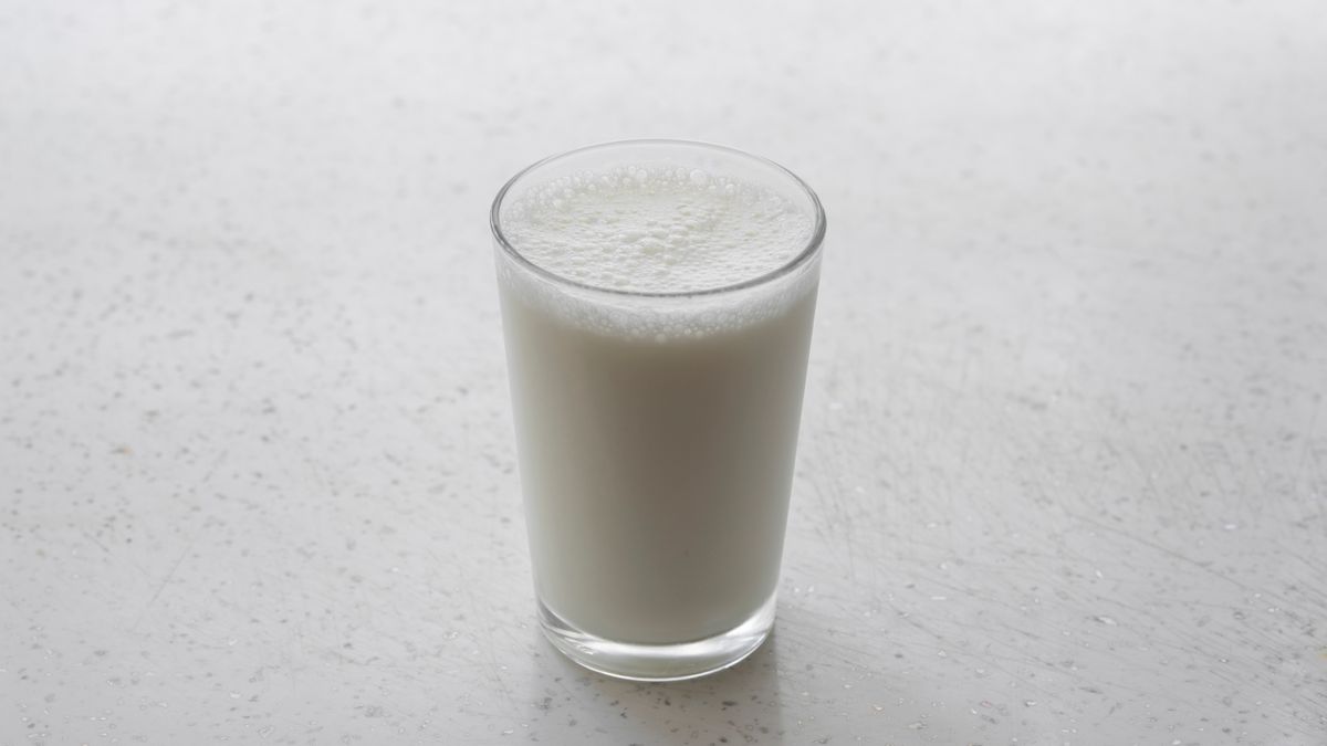A glass of milk on a pale worktop